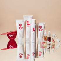 Produtos do kit rotina completa GE Beauty em composição com fundo vermelho